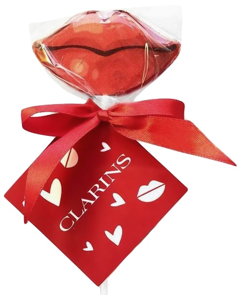 Леденцы-губки с ленточкой и логотипом Clarins на бирке
